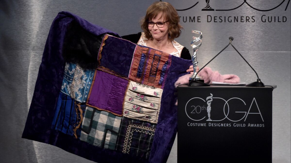 Sally Field speaks onstage about costume designer Joanna Johnston, who received an award for career achievement, during the Costume Designers Guild Awards at the Beverly Hilton Hotel on Tuesday.