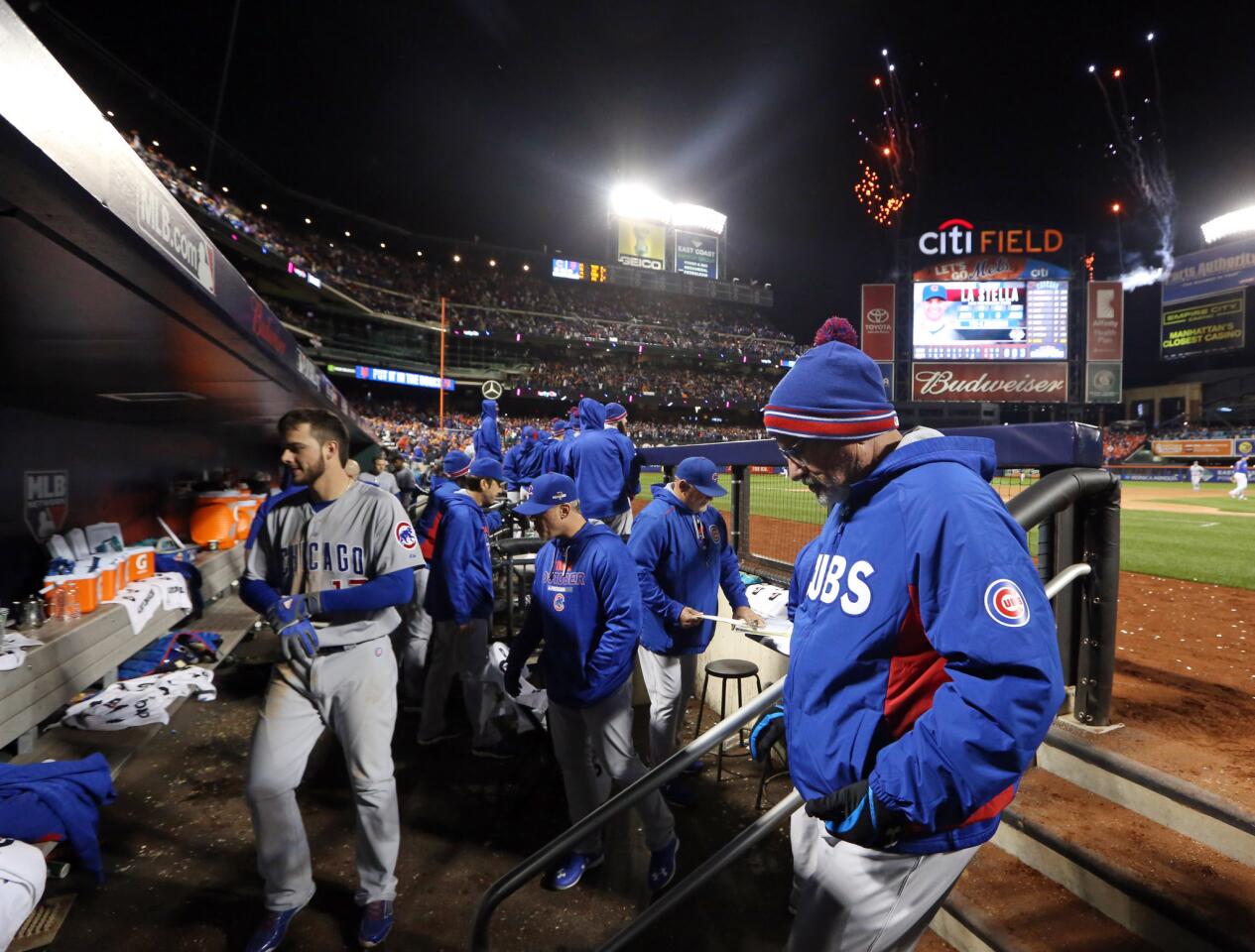 Cubs manager Joe Maddon and his team head in after the loss in Game 1 of the NLCS playoff Oct. 17, 2015, at Citi Field in New York. The Mets defeated the Cubs, 4-2.