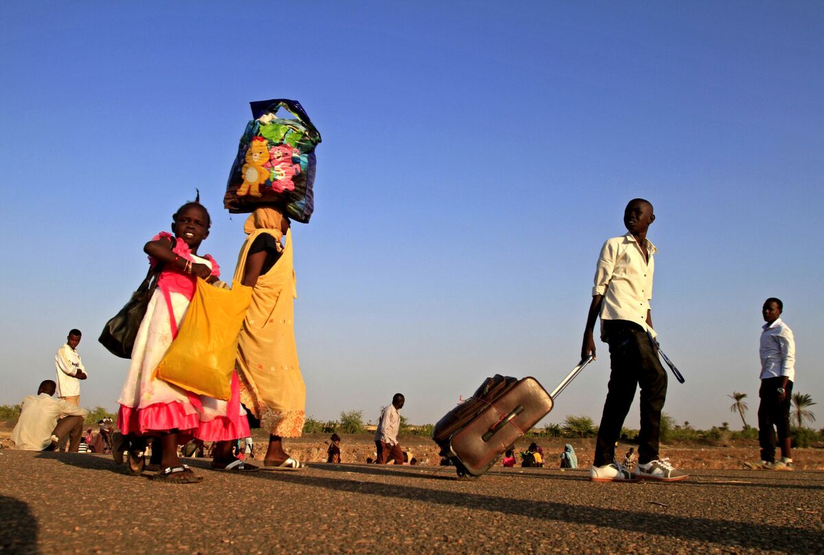South Sudanese refugees arrive at a border checkpoint in Joda, Sudan.