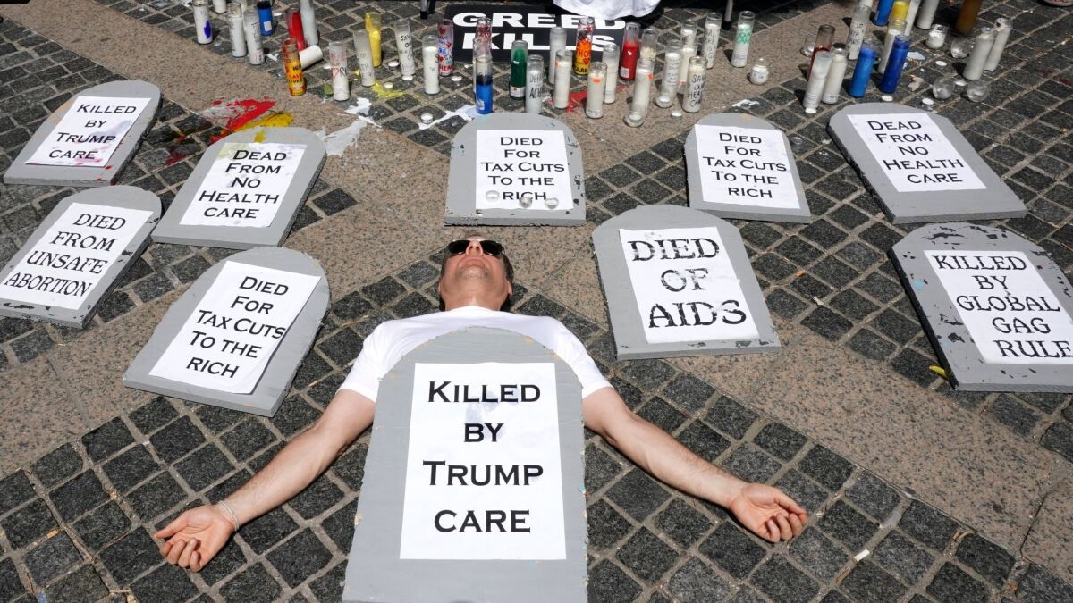 Health care advocates are in the midst of a 24-hour vigil outside of the Trump International Hotel and Tower at Columbus Circle in New York on June 22.