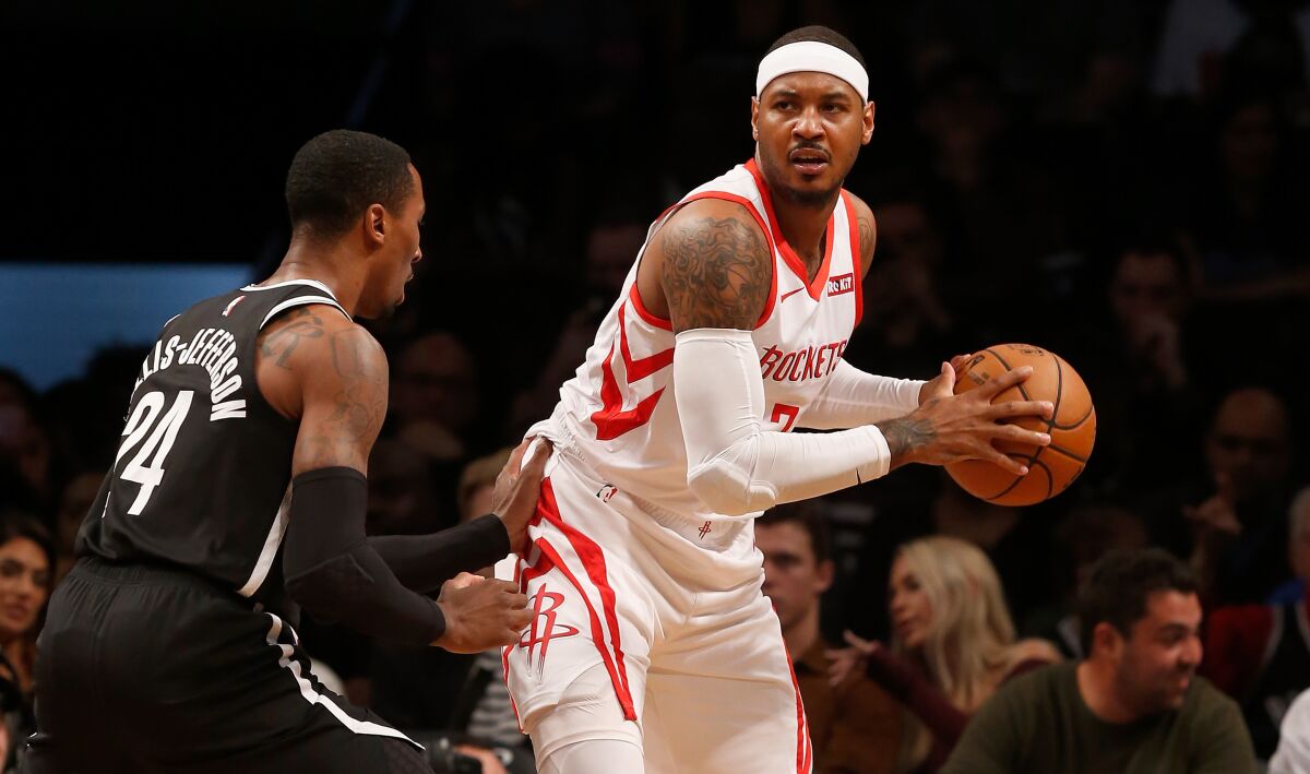 Houston Rockets small forward Carmelo Anthony controls the ball against the Brooklyn Nets.