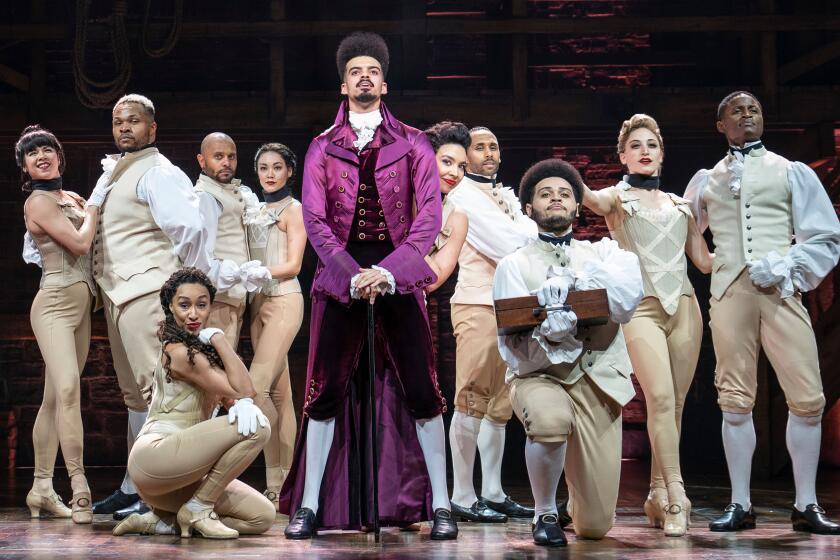 Suni Reid, pictured with "Hamilton" cast members, filed a complaint accusing the musical of discrimination and retaliation.