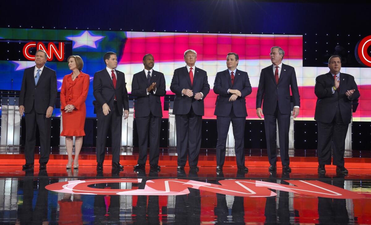 Republican presidential candidates, from left, John Kasich, Carly Fiorina, Marco Rubio, Ben Carson, Donald Trump, Ted Cruz, Jeb Bush, Chris Christie, and Rand Paul take the stage during the Republican presidential debate at the Venetian Hotel & Casino in Las Vegas.