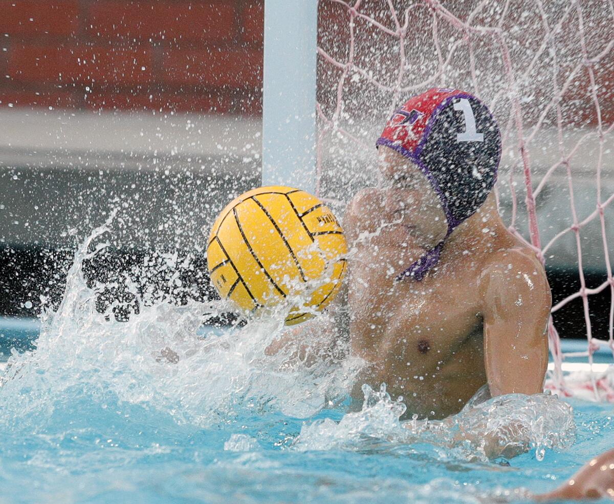 Hoover's goalie Oliver Baker makes a stop on an Arcadia shot off his face in a Pacific League boys' water polo final at Arcadia High School on Thursday, October 31, 2019. Hoover won the Pacific League title beating Arcadia 10-6.
