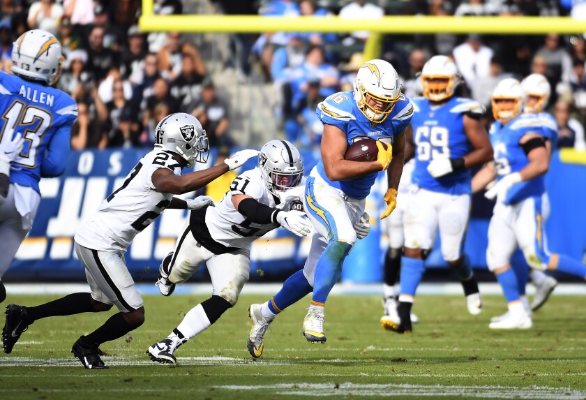 Chargers tight end Hunter Henry runs after a catch against the Oakland Raiders.