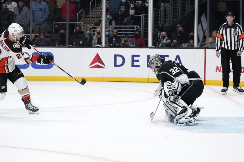 Anaheim Ducks defenseman Kevin Shattenkirk, left, scores on Los Angeles Kings goaltender Jonathan Quick during a shootout in an NHL hockey game Tuesday, Nov. 30, 2021, in Los Angeles. The Ducks won 5-4 in a shootout. (AP Photo/Mark J. Terrill)