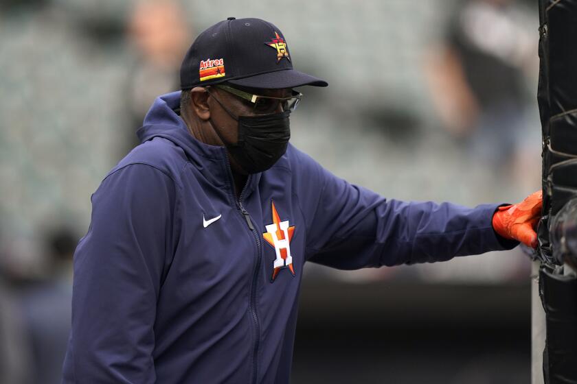 Houston Astros manager Dusty Baker Jr., watches warmups before Game 3 of a baseball American League Division Series.