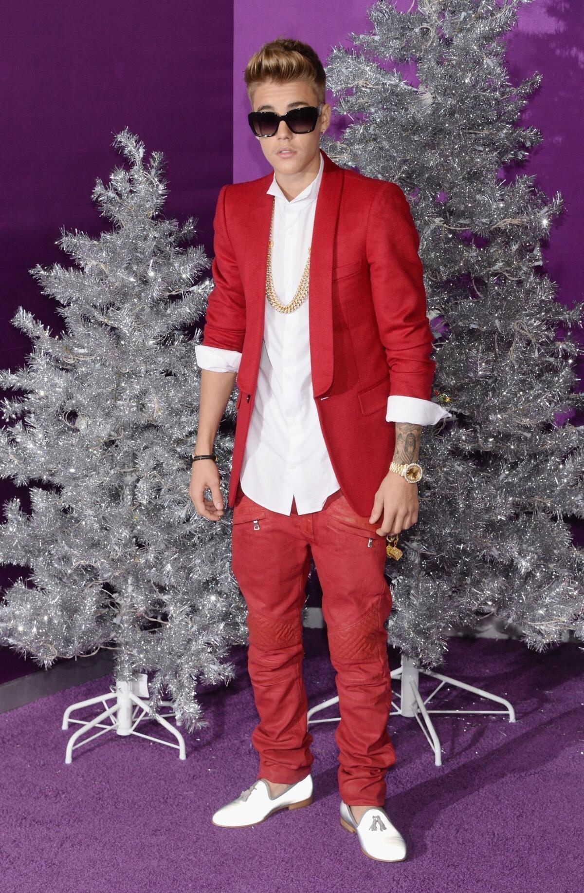 Justin Bieber wears Balmain to emulate Frank Sinatra at the premiere of "Justin Bieber's Believe" in Los Angeles.