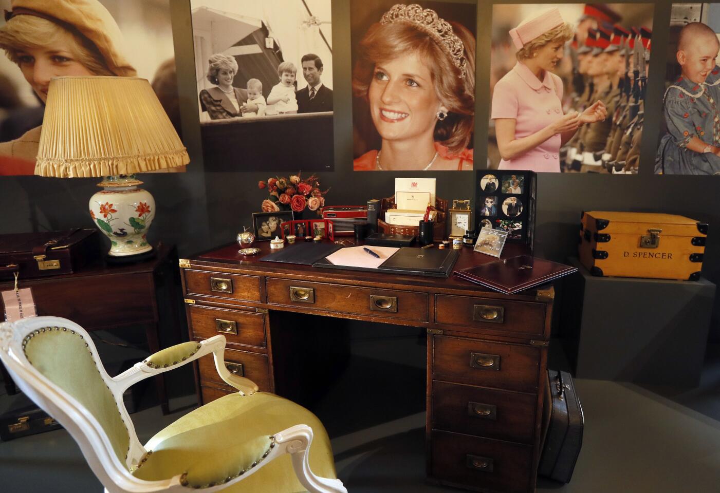 A display to mark the 20th anniversary of the death of Britain's Diana, Princess of Wales, a recreation of the desk where Princess Diana worked in her Sitting room at Kensington Palace, on display at Buckingham Palace in London, Thursday, July 20, 2017. Summer visitors to the State Rooms at Buckingham Palace will also be able to see a display of over 200 gifts presented to Her Majesty The Queen over her 65 year reign. (AP Photo/Kirsty Wigglesworth)