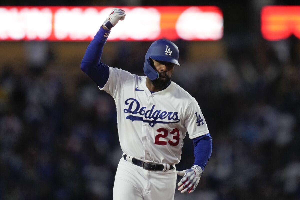 Dodgers' Jason Heyward rounds the bases after hitting a home run.