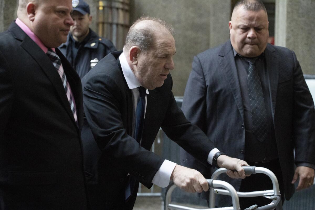 Harvey Weinstein, center, arrives for a court hearing, Wednesday, Dec. 11, 2019 in New York.