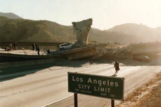 LOS ANGELES - JAN 17, 1994 - City of Los Angeles sign in the foreground of the Interstate 5 southbound lanes where the Interstate 14 road fell. The motorcycle and body of deceased LAPD officer Dean is seen at left. (Steve Dykes / Los Angeles Times)
