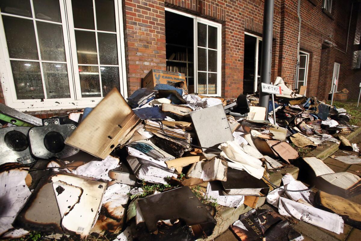 Burnt and damaged files lie in the courtyard of the German regional newspaper Hamburger Morgenpost after arsonists struck in Hamburg.