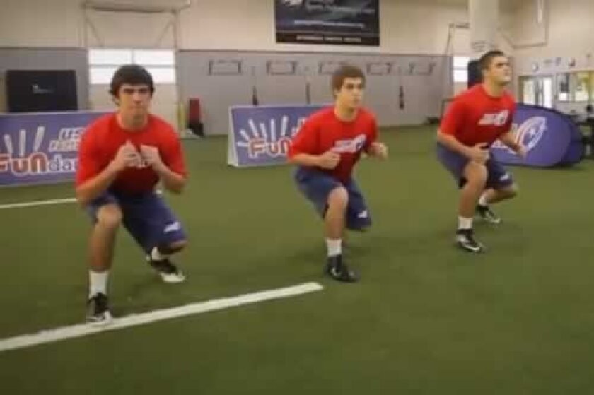 This screen grab from a training video demonstrates a ‘hit’ maneuver of Heads Up Tackle, which creates tension in the muscles as opposed to the joints, in preparing for a tackle. usafootball.com