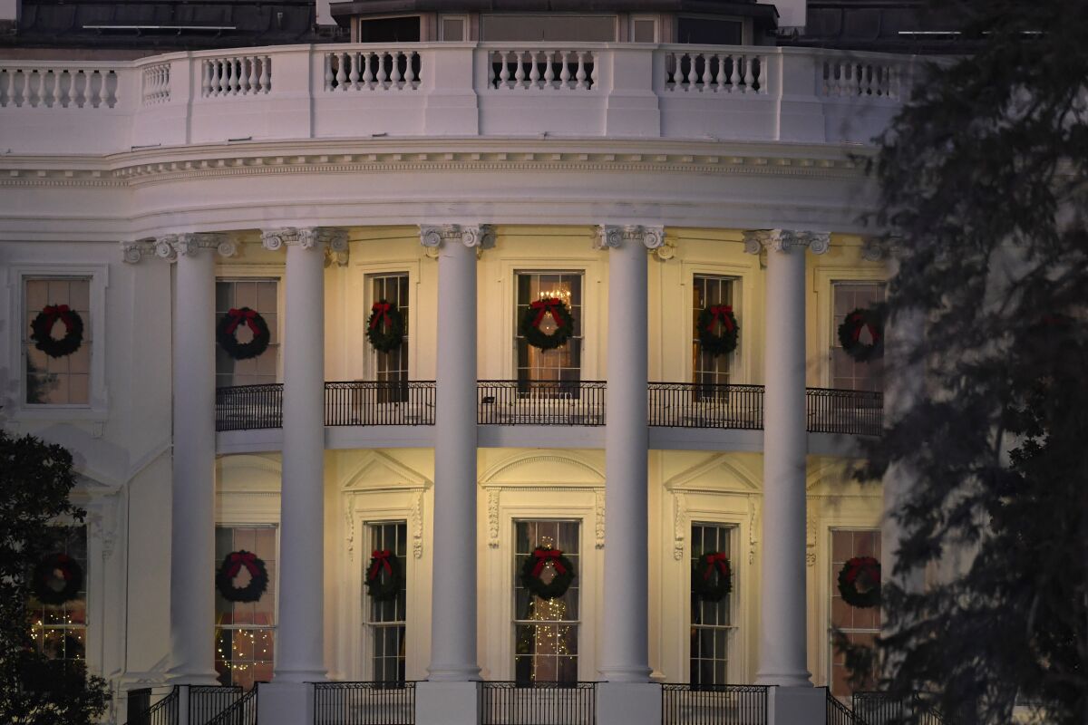 In this Dec. 5, 2019 photo, a view of the south side of the White House in Washington decorated for Christmas. The Associated Press-NORC Center for Public Affairs Research poll released Friday finds only about 1 in 10 Americans expect a downturn in their own lives in 2020. But about 4 in 10 say the way things are going nationwide will get worse in the year ahead. 2020 is an election year, and that might have something to do with it: Most Democrats and Republicans alike say they're dissatisfied with the state of politics. (AP Photo/Susan Walsh)
