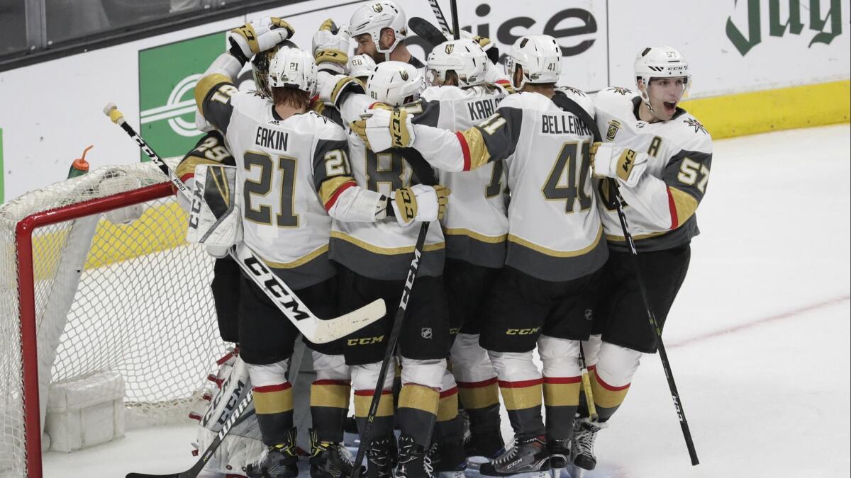 The Vegas Golden Knights celebrate around goalie Marc-Andre Fleury after sweeping the Kings in four games out of Round 1 of the Stanley Cup playoffs at Staples Center on Tuesday.