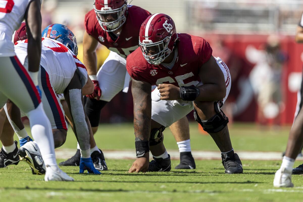 Alabama offensive lineman JC Latham sets up for a play against Mississippi.
