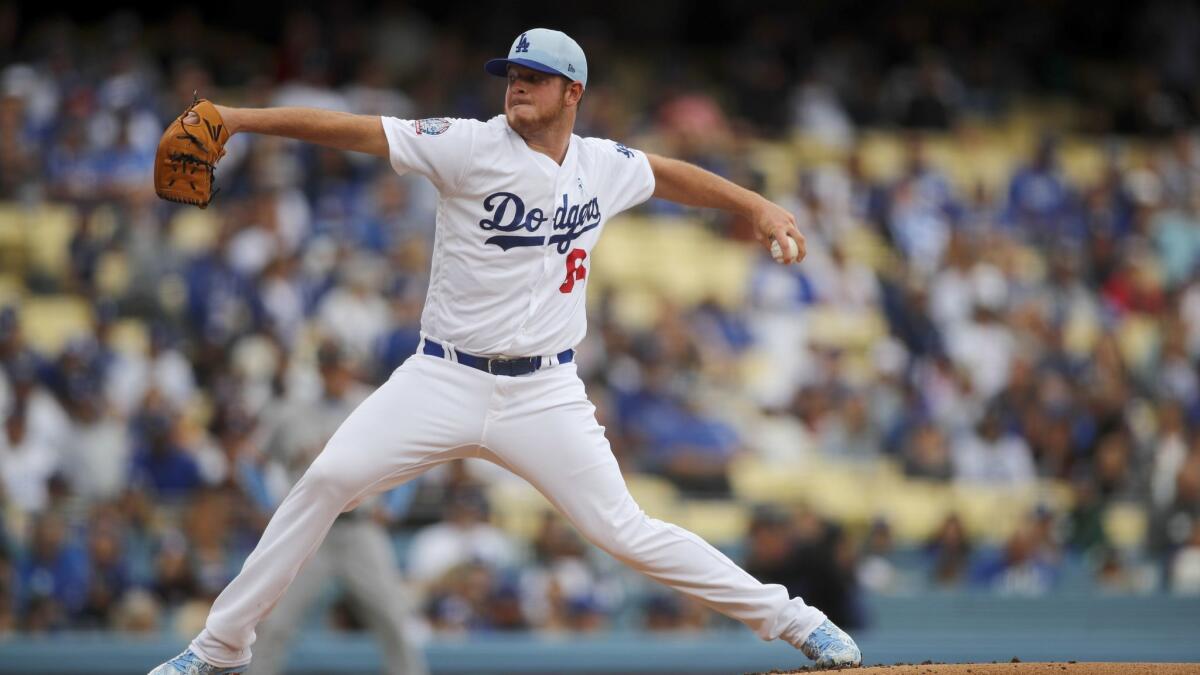 Dodgers pitcher Caleb Ferguson delivers a pitch in the first inning against the Giants.