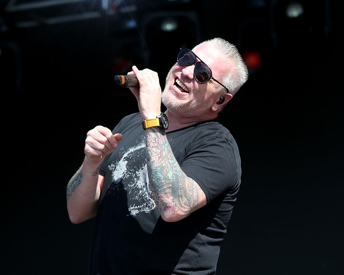Steve Harwell of Smash Mouth performing on stage.