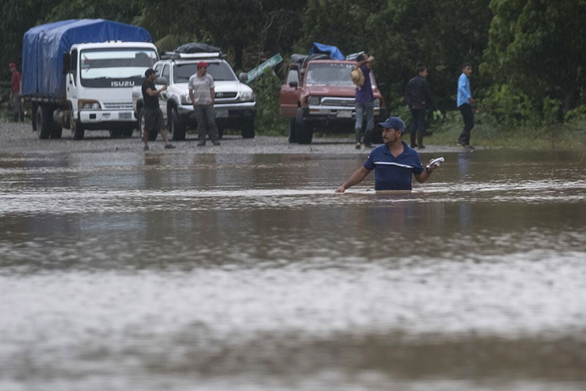 A man wades through floodwaters in Okonwas, Nicaragua, on Wednesday after Hurricane Eta passed through.
