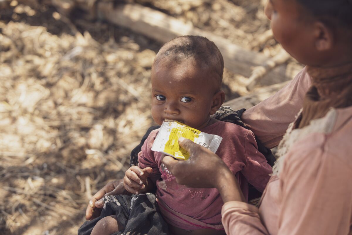 A mother feeds her 6-month-old daughter in Ankilimanondro, Madagascar.