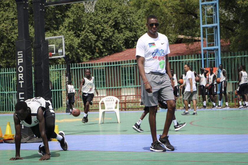 FILE - Masai Ujiri walks on the basketball court during a three-day basketball training camp run by Giants of Africa in Juba, South Sudan on Aug. 20, 2019. Several prospects from the NBA Academy in Africa are playing in the new season of the Basketball Africa League. Now in its third season, the league was created by the NBA in partnership with FIBA to help grow the sport in Africa. (AP Photo/Sam Mednick, File)