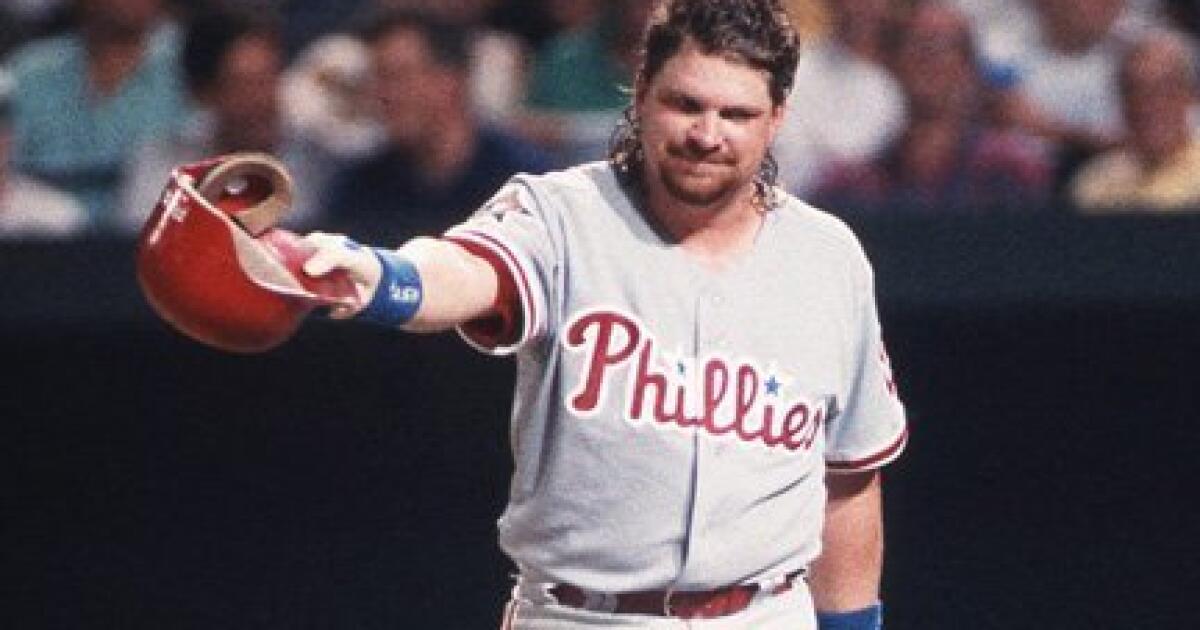 Randy Johnson buzzes John Kruk up high and then makes him look