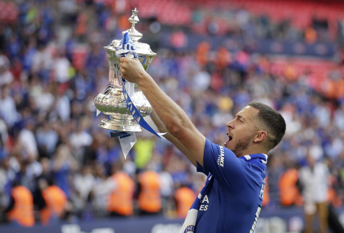 Eden Hazard celebrates with the trophy after Chelsea's victory over Manchester United in the English FA Cup final May 19, 2018.