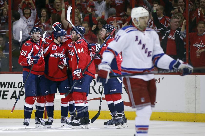 The Capitals celebrate around center Jay Beagle (83) after his second period goal in Game 3 of the second round playoffs against the New York Rangers. The Capitals won 1-0.