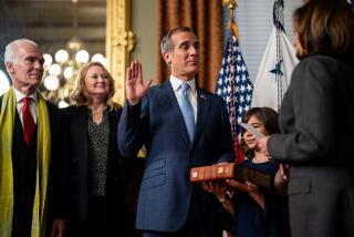 WASHINGTON, DC - MARCH 24: Vice President Kamala Harris (R) ceremonially swears-in Eric Garcetti as the Ambassador to India in the Vice President's Ceremonial Office in the Eisenhower Executive Office Building on Friday, March 24, 2023 in Washington, DC. After Garcetti's first nomination stalled in the Senate due to concerns about his knowledge about a former top aide's alleged sexual harassment of colleagues, his nomination was resubmitted and passed the senate 52 to 42, with seven Republicans joined all but three Democrats present in approving him for the post. (Kent Nishimura / Los Angeles Times)