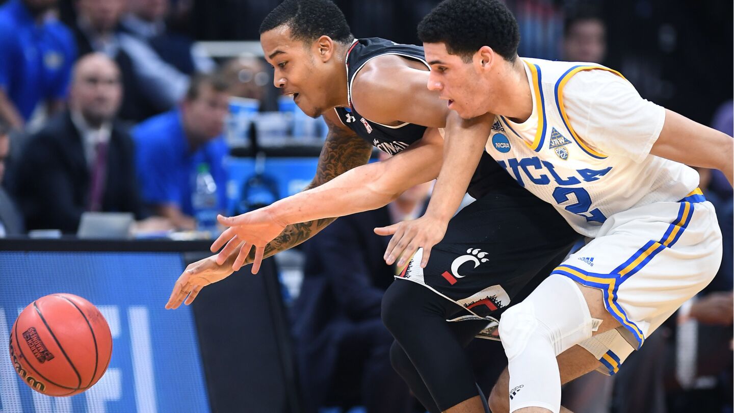 UCLA guard Lonzo Ball forces Cincinnati guard Troy Caupin into a turnover during the first half.