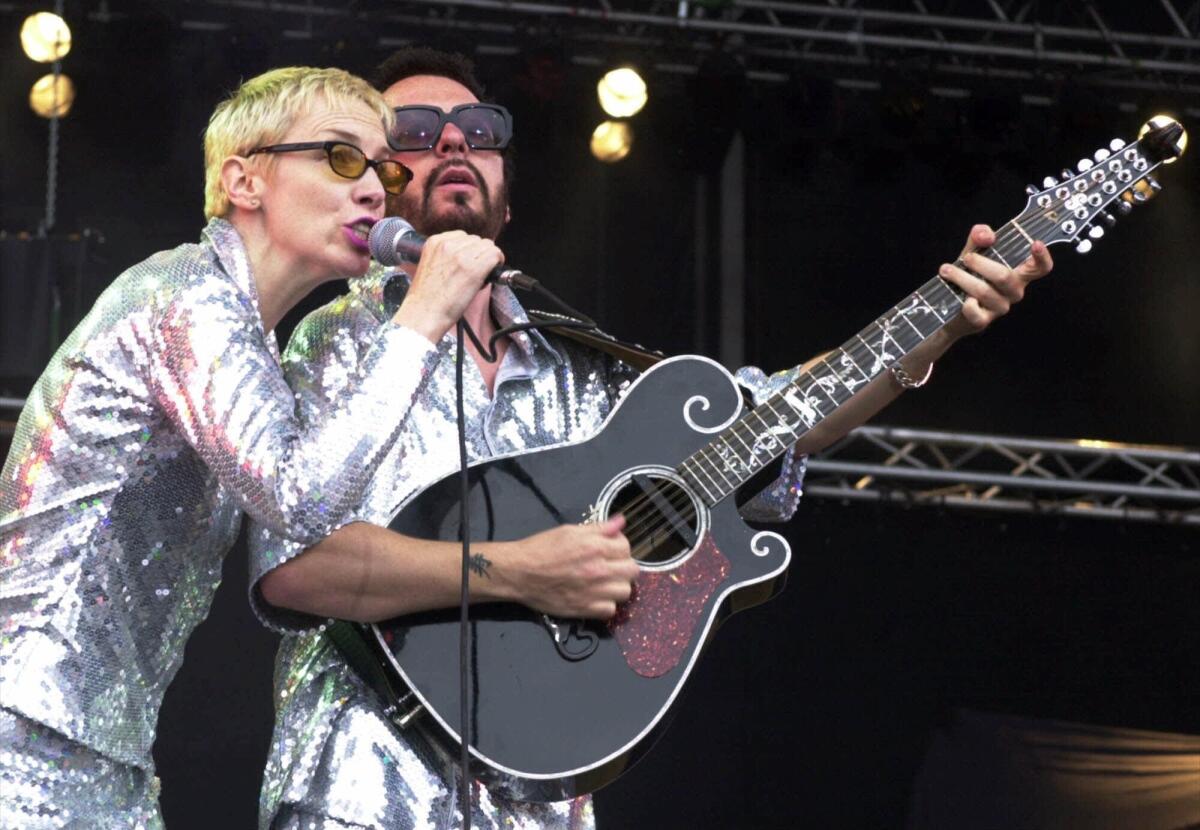 Annie Lennox and Dave Stewart, shown in a Eurythmics performance in 2000 in Germany, are reuniting to pay tribute to the Beatles on a TV special slated to air Feb. 9 on the 50th anniversary of the group's first appearance on "The Ed Sullivan Show."