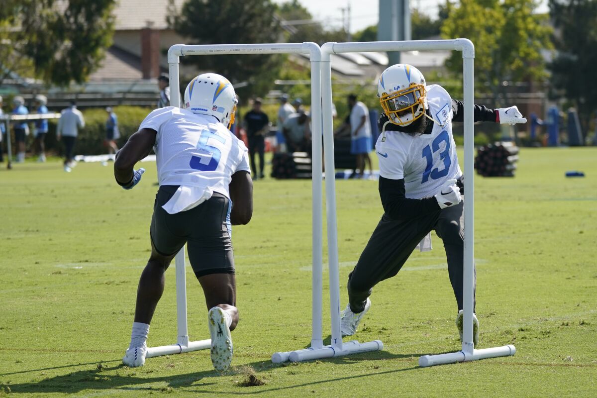 Chargers receivers Joshua Palmer (5) and Keenan Allen take part in a drill at training camp.