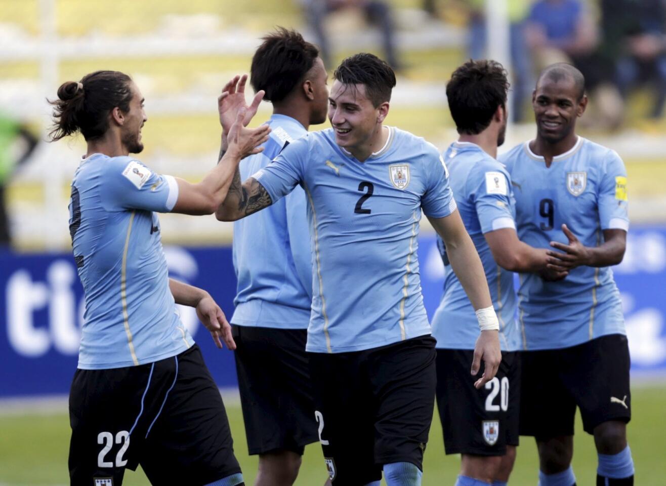 Jose Caceres of Uruguay celebrates with teammates after his victory against Bolivia during their 2018 World Cup qualifying soccer match in La Paz