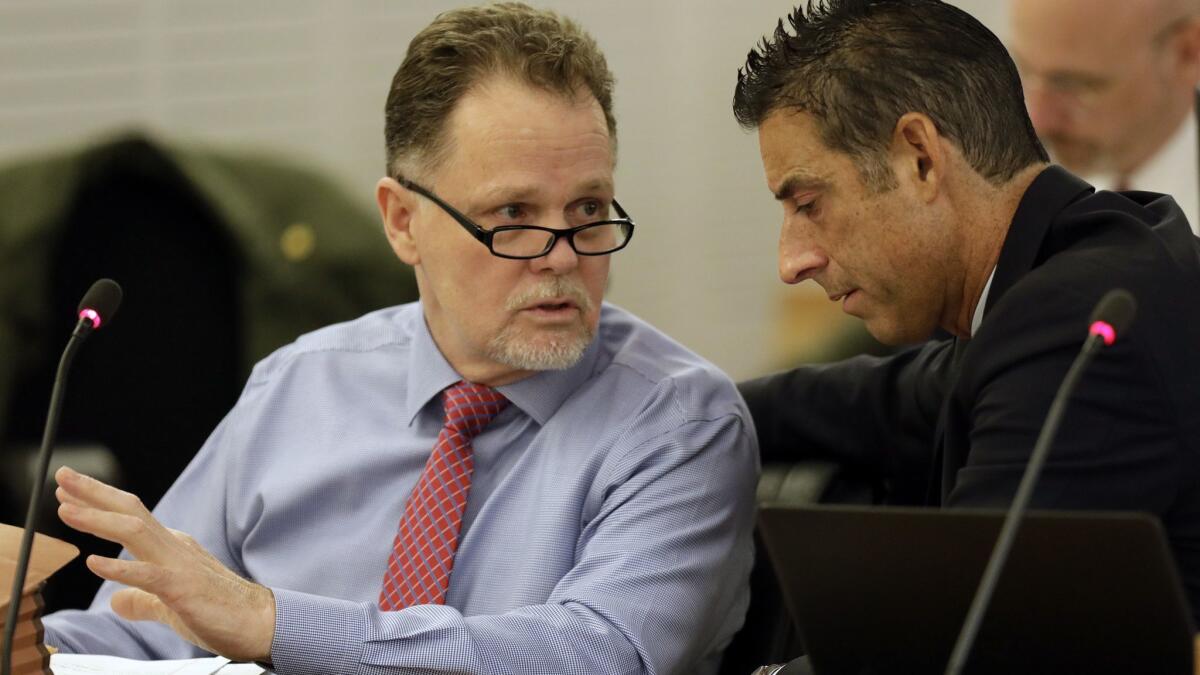 Charles "Chase" Merritt, left, pictured here on the first day of his murder trial, is accused of killing the McStay family in 2010 and burying their bodies in the desert in Victorville.