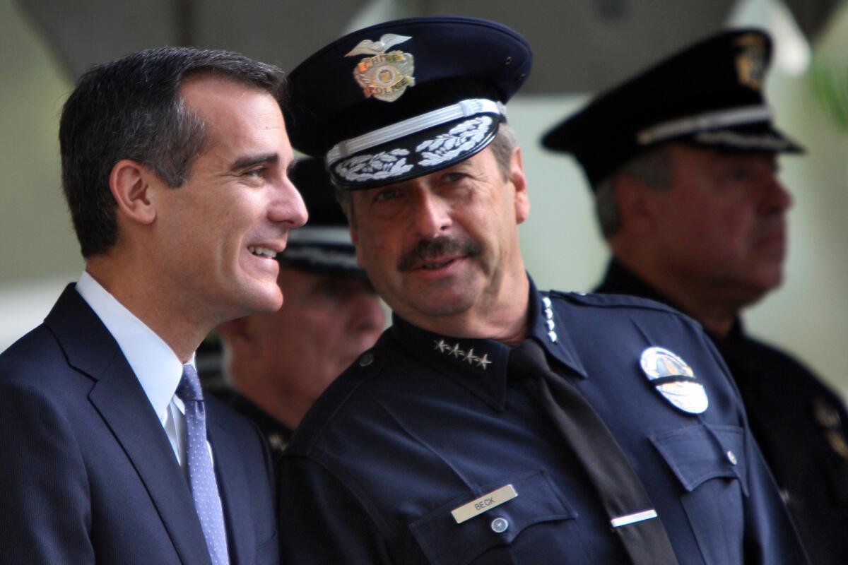Los Angeles Mayor Eric Garcetti and Police Chief Charlie Beck, seen in October, are expected to attend Tuesday's Operation Shoes From Santa event.
