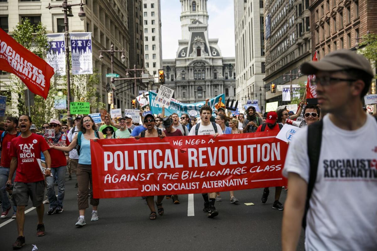 Bernie Sanders supporters march down Broad Street in Philadelphia on Sunday. (Marcus Yam / Los Angeles Times)