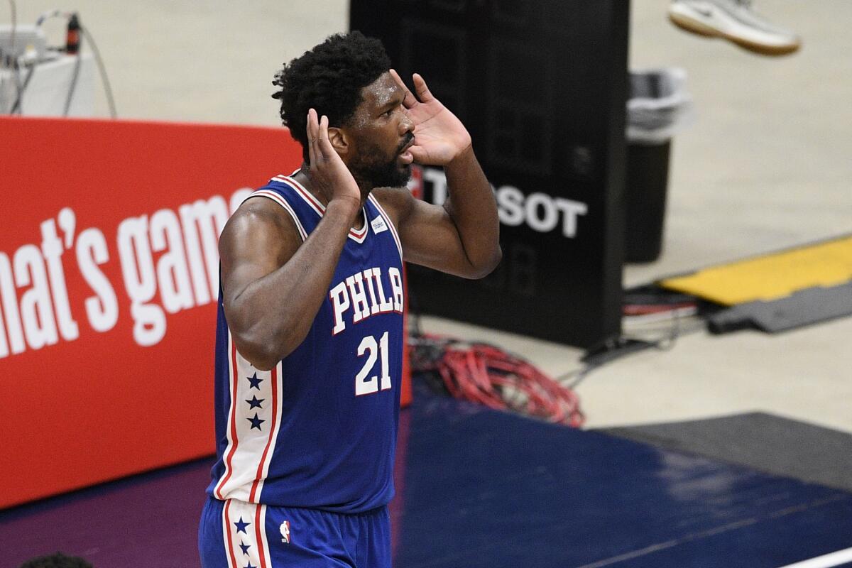 76ers center Joel Embiid gestures to the crowd during Game 3 on May 29, 2021.