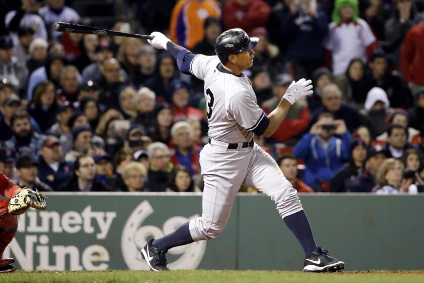 New York Yankees pinch hitter Alex Rodriguez hits a solo homer in the eighth inning against the Boston Red Sox at Fenway Park on Friday. Rodriguez has now tied slugger Willie Mays with 660 career home runs.