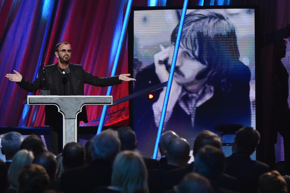 Ringo Starr speaks at his induction into the Rock and Roll Hall of Fame in Cleveland.