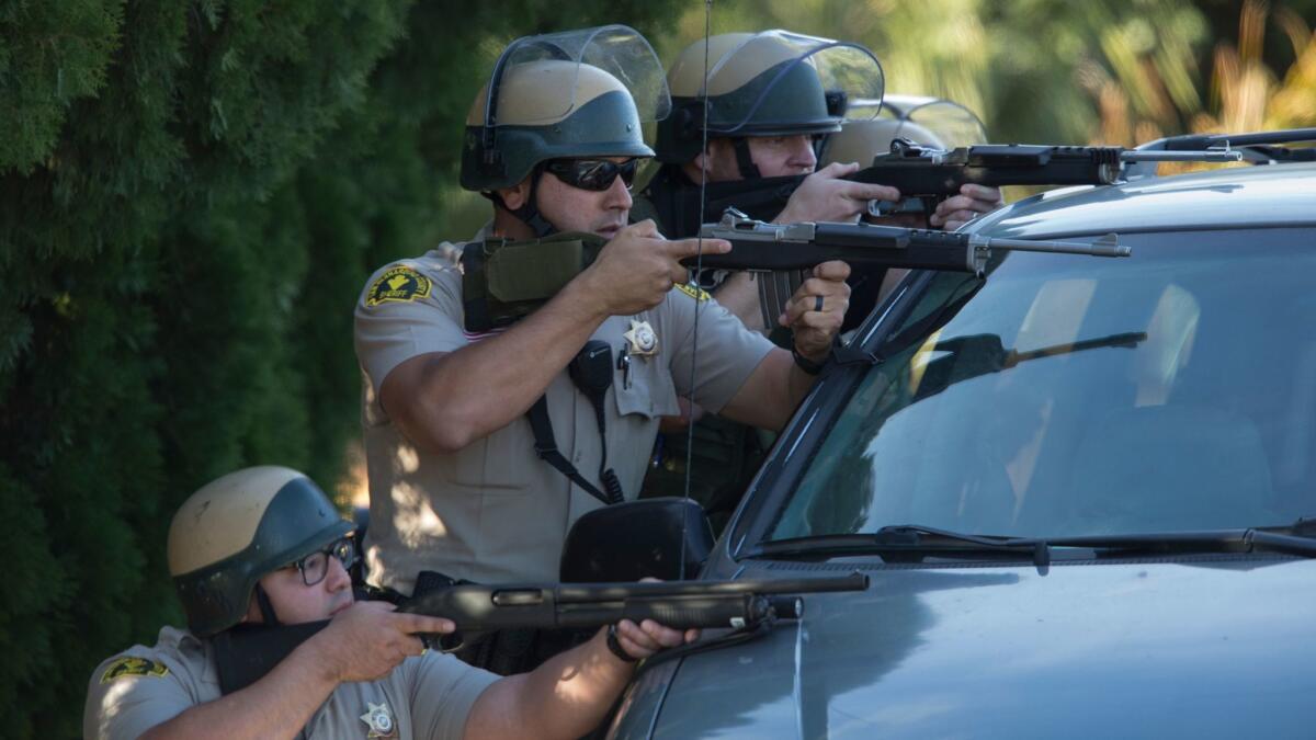 Officers responding following the San Bernardino terror attack on Dec. 2, 2015. (Gina Ferazzi / Los Angeles Times)