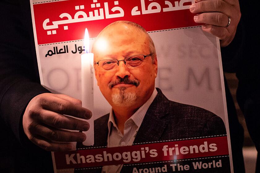 A poster featuring a photo of journalist Jamal Khashoggi is displayed during a gathering outside the Saudi Arabian consulate in Istanbul, Turkey, on Oct. 25, 2018.