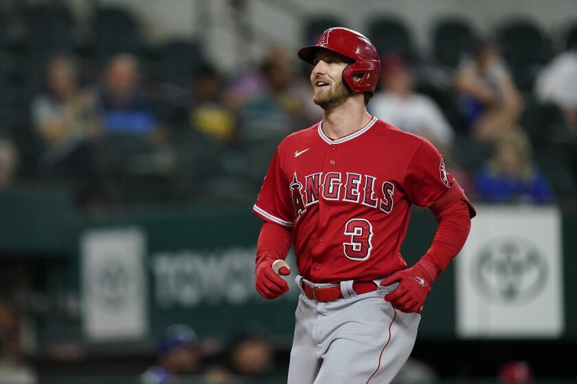 Los Angeles Angels' Taylor Ward jogs to the plate after hitting a two-run home run during a baseball game against the Texas Rangers in Arlington, Texas, Tuesday, Sept. 20, 2022. (AP Photo/Tony Gutierrez)
