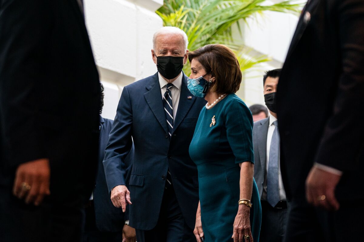 President Biden and Speaker Nancy Pelosi leaving a House Democratic Caucus meeting