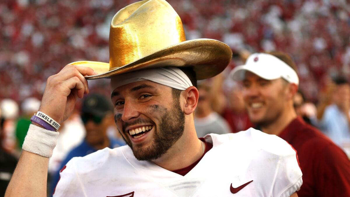 Oklahoma quarterback Baker Mayfield celebrates with the golden hat trophy following the Sooners' 29-24 win over Texas in the annual Red River Rivalry game on Oct. 14.