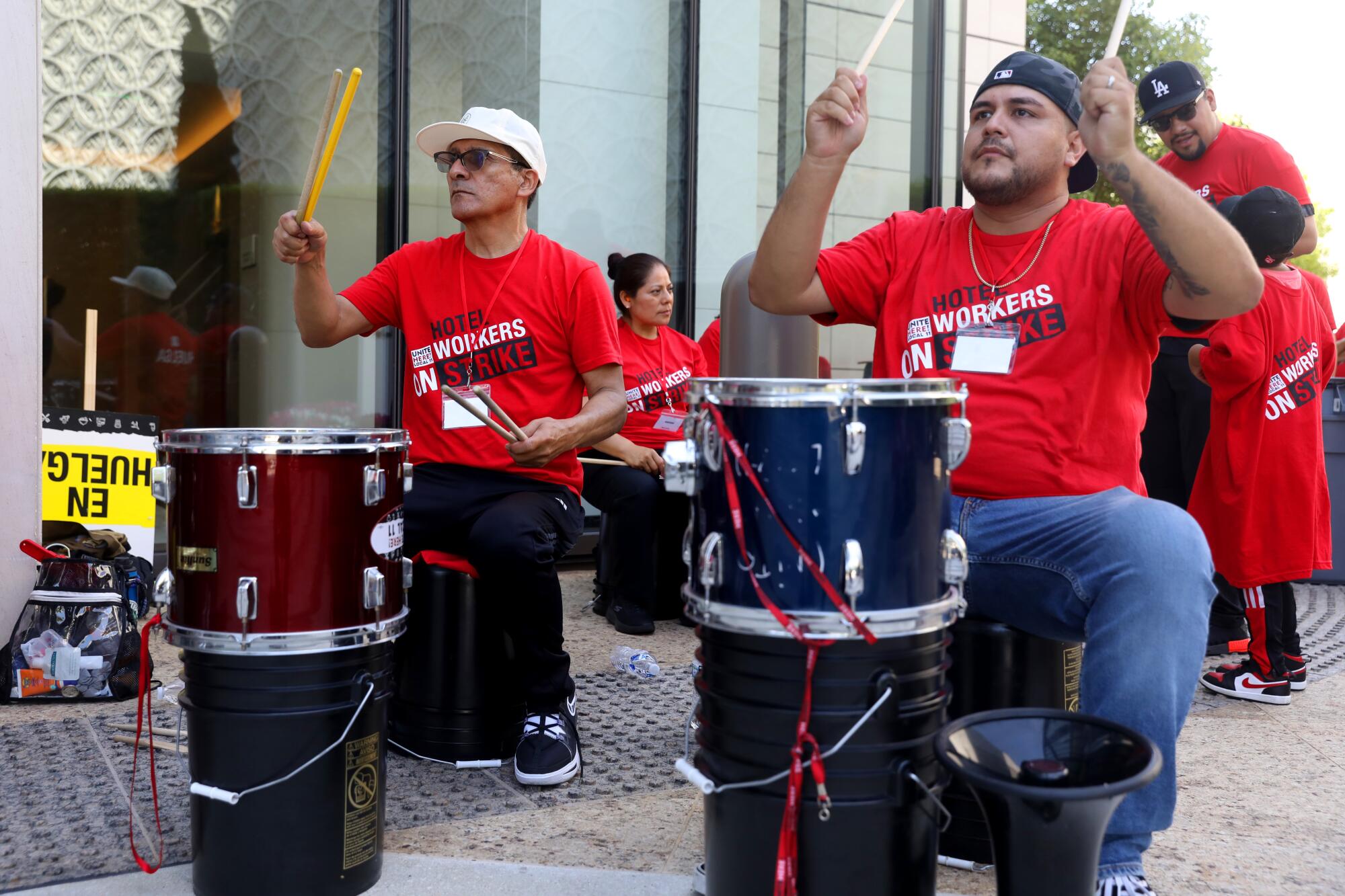 Striking hotel workers pound drums at the Waldorf Astoria on July 24