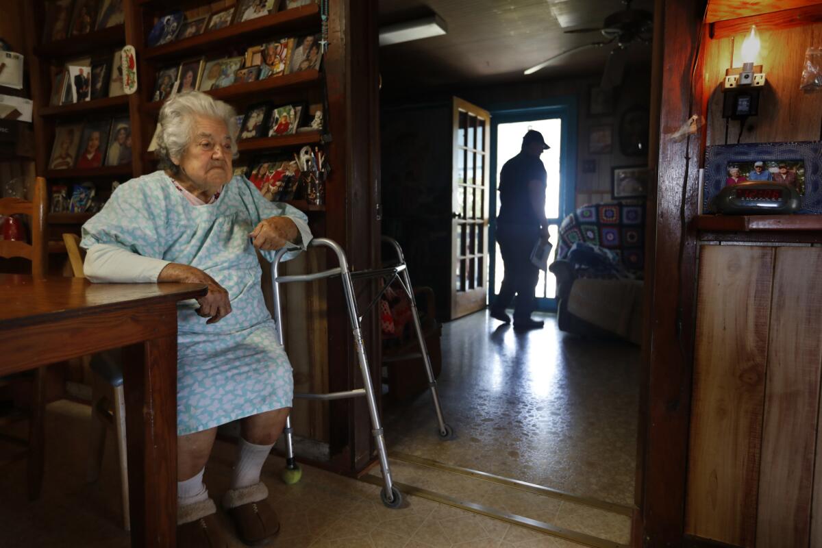 Chief Albert Naquin visits his older sister, Denecia Billiot, age 94, who still live on the Isle de Jean Charles. (Carolyn Cole / Los Angeles Times)