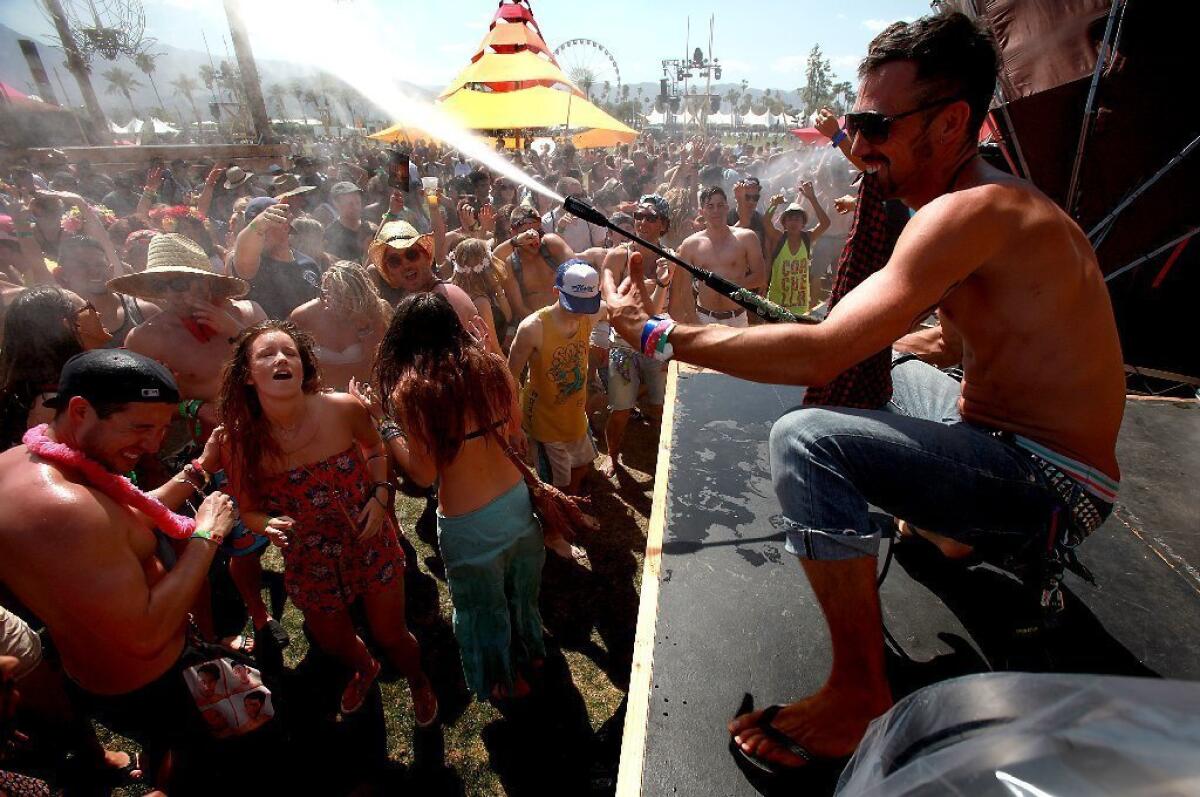 Festival-goers revel in cold water spray in the Do LaB during the first day of the Coachella Music & Arts Festival.