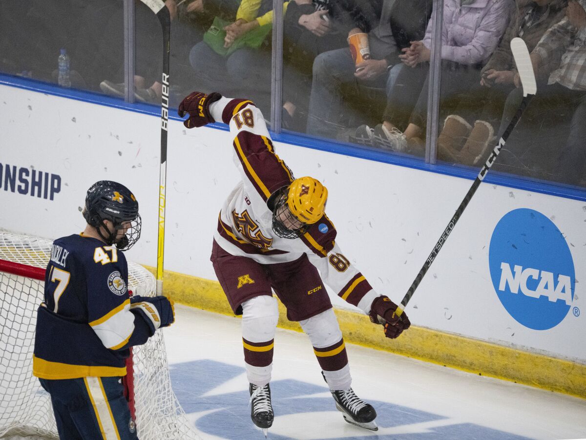 Minnesota forward Jimmy Snuggerud (81) celebrates after scoring an insurance goal against Canisius in the third period of an NCAA Division I men's college hockey championship first-round game Thursday, March 23, 2023, in Fargo, N.D. (Jeff Wheeler/Star Tribune via AP)
