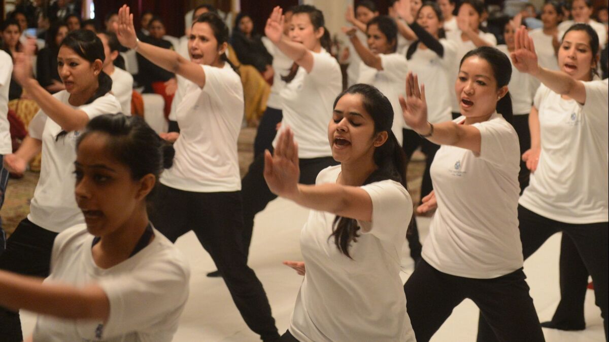 Women practice during a self-defense class led by New Delhi police.
